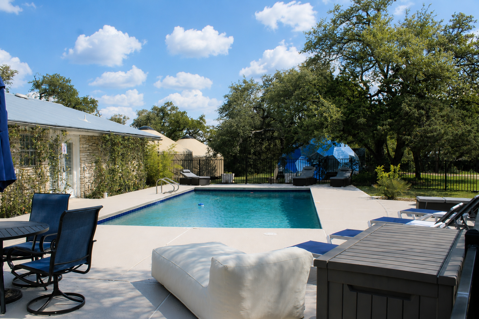 Pool and sun deck at AWKN Ranch